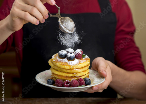 man sprinkles with powdered sugar home punkeys photo