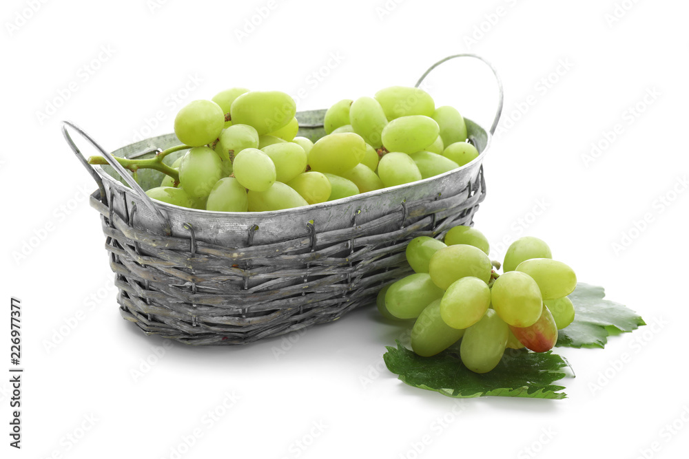 Basket with ripe juicy grapes on white background Basket with ripe juicy grapes on white background