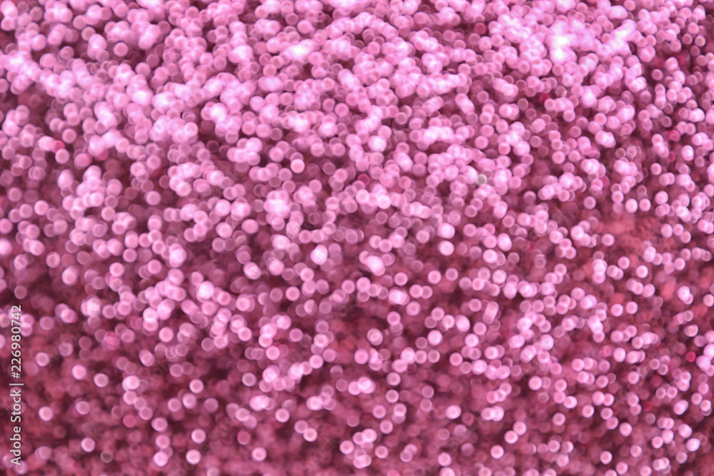 Blurred view of shiny pink sequins Blurred view of shiny pink sequins