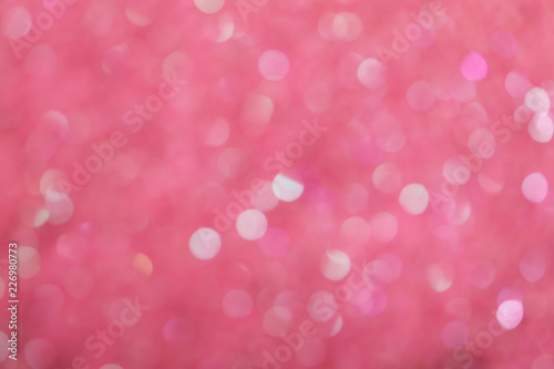 Blurred view of shiny pink sequins