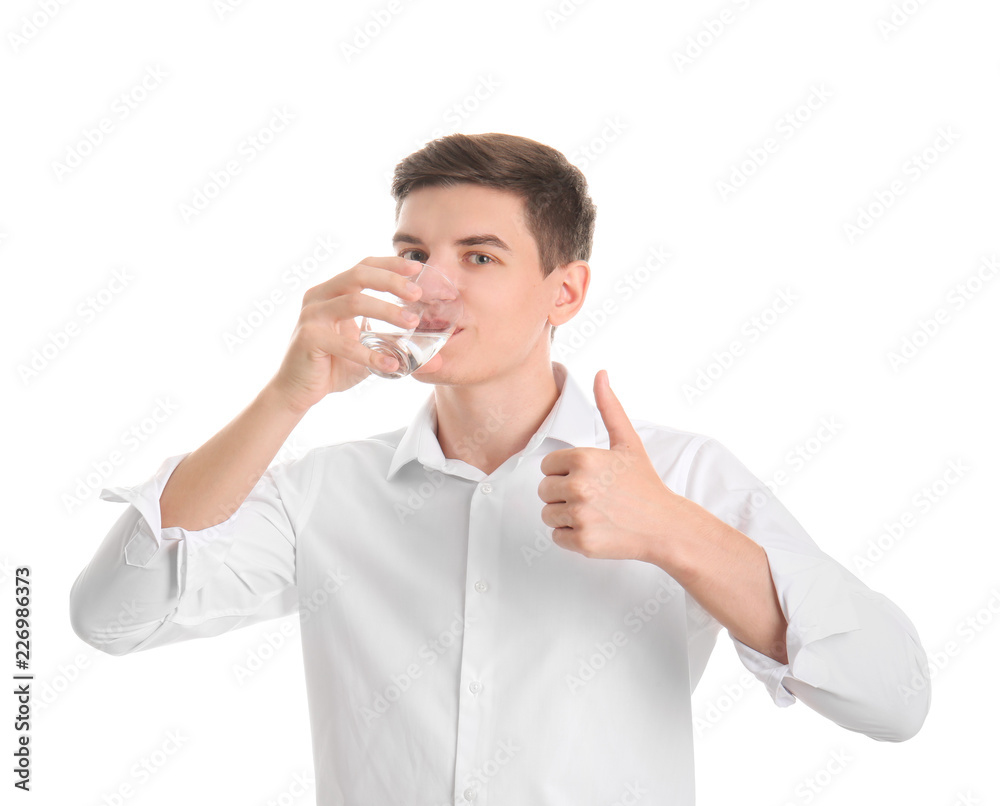 Young man drinking water on white background Young man drinking water on white background