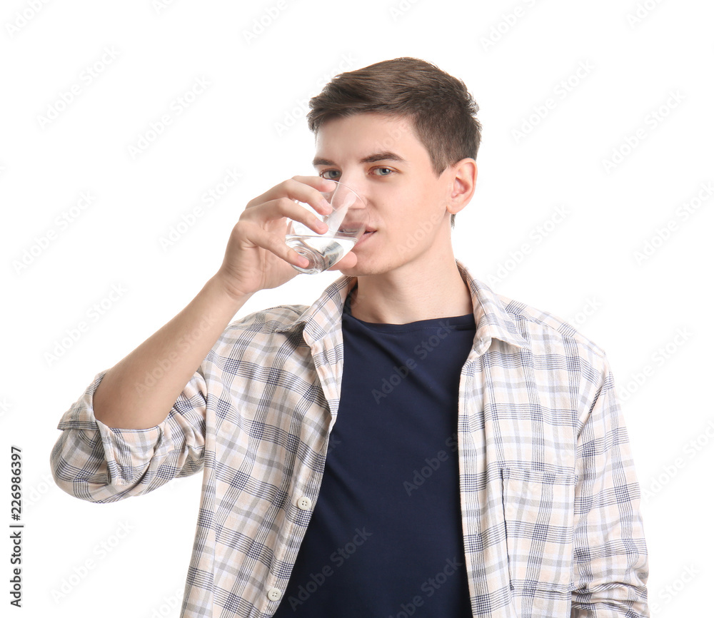 Young man drinking water on white background Young man drinking water on white background