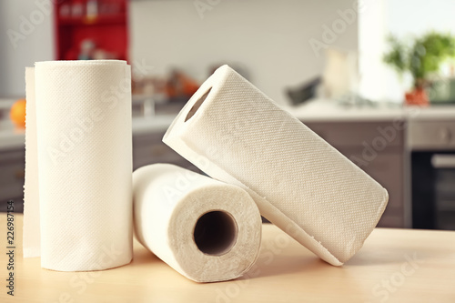 Rolls of paper towels on kitchen table