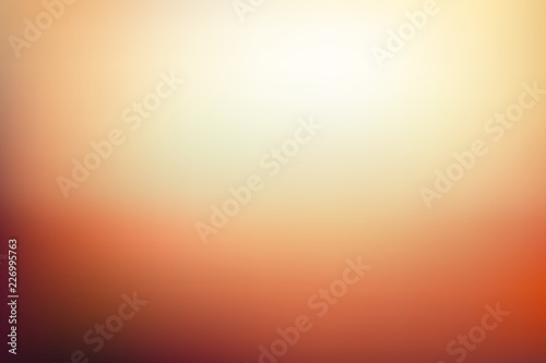 Abstract blurred background in golden orange and yellow tones. Autumn colors vector illustration. Sunset scene color gradient