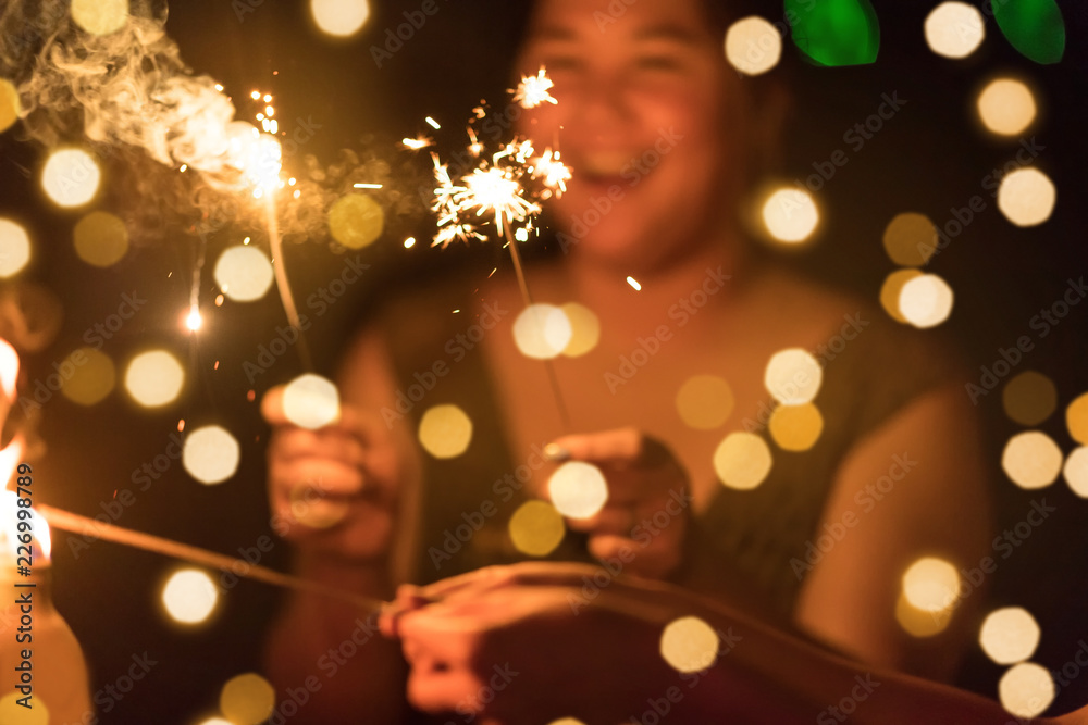 Abstract blurred of Sparklers with group of friends having fun for