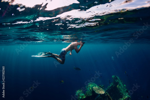 Freediver swim in the sea at USS Liberty Wreck  Bali