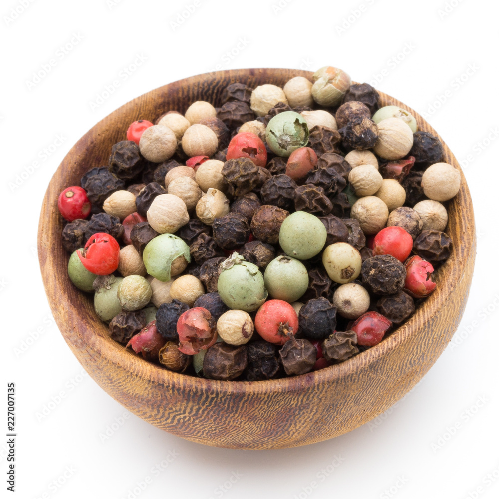 Pepper mix seed on spoon on white background. Pepper mix seed on spoon on white background.