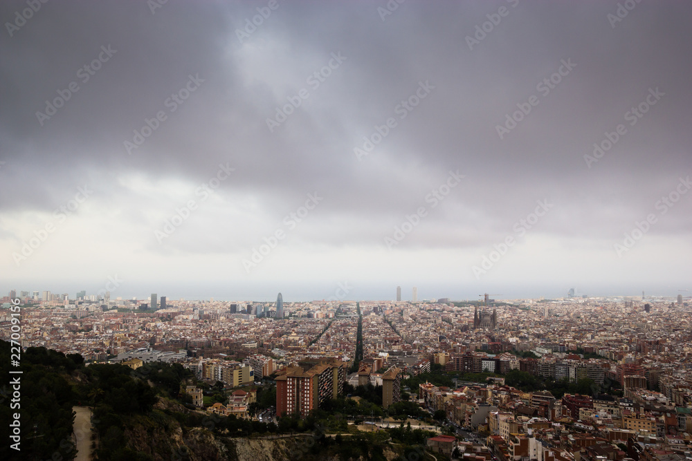 Cloudy view on Barcelona city from the mountain Cloudy view on Barcelona city from the mountain