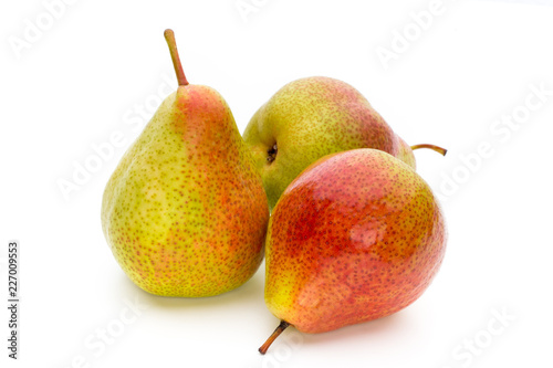 Fresh bio pear with leaves on isolated white background.