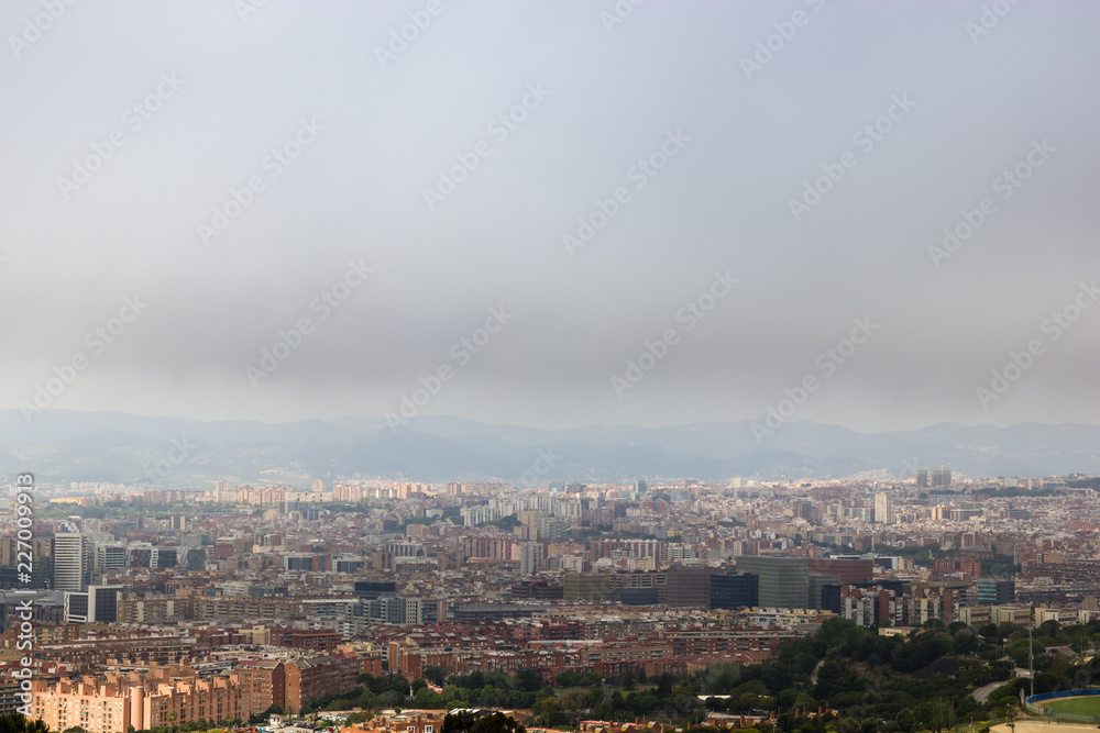 View on the Barcelona cloudy city from the Montjuic hill