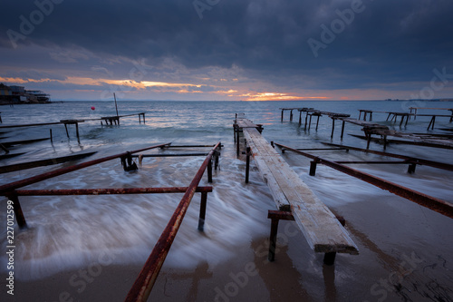 Seascape during sunset. Beautiful natural seascape, blue hour. Sea sunset at the Black Sea coast. Magnificent sunset with clouds in the middle of December.Ravda, Bulgaria photo