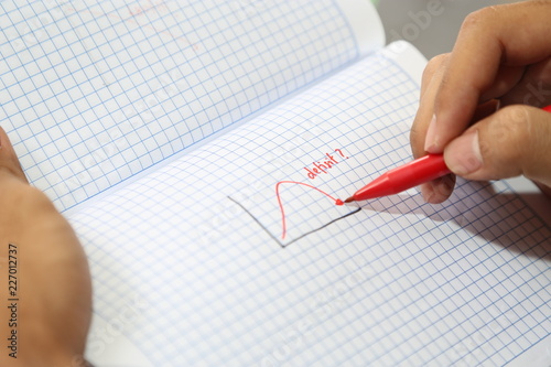 business hand drawing deficit graph