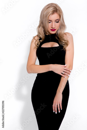 Fashion model on a white background, model witha a red lips, model in a black dress, little black dress
