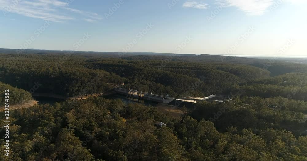 Lush evergreen woods around Warragamba river blocked by Warragamba dam to form fresh water catchment area for Greater Sydney water supply.
