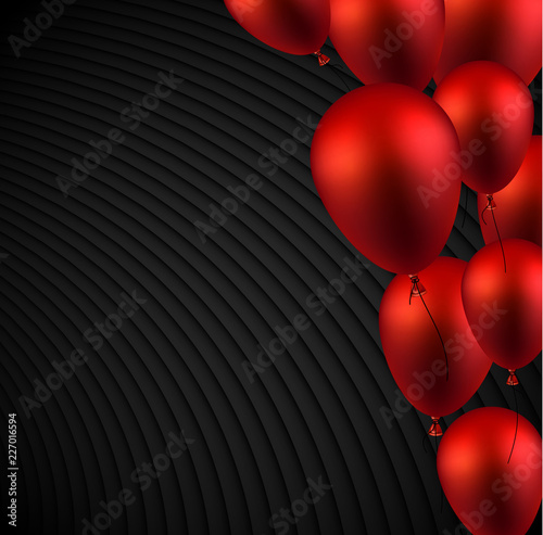 Black textured background with red shiny balloons. Holiday decoration.