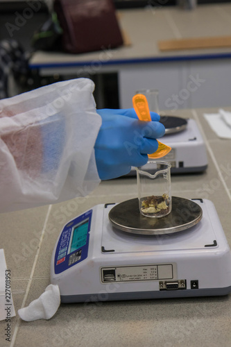 Working process in nanotechnology   laboratory of cosmetic production. Mixing components.
