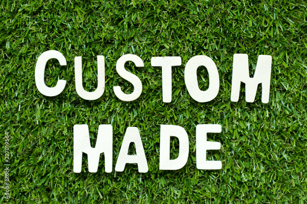 Alphabet letter in word custom made on artificial green grass