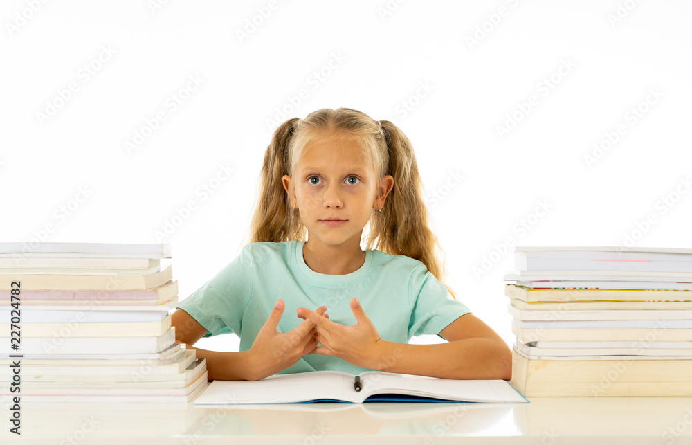 Cute smiling little girl with a pile of books feeling happy Cute smiling little girl with a pile of books feeling happy