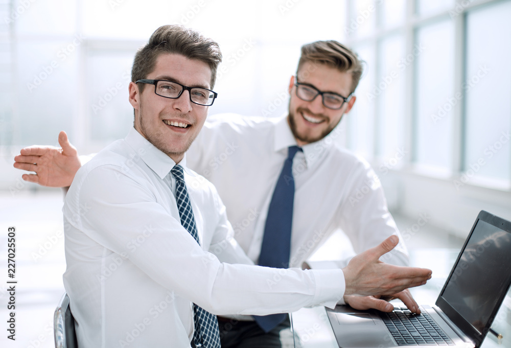close up.two successful employees in the workplace close up.two successful employees in the workplace