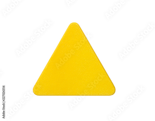 Yellow wooden block in the shape of triangle isolated on white.