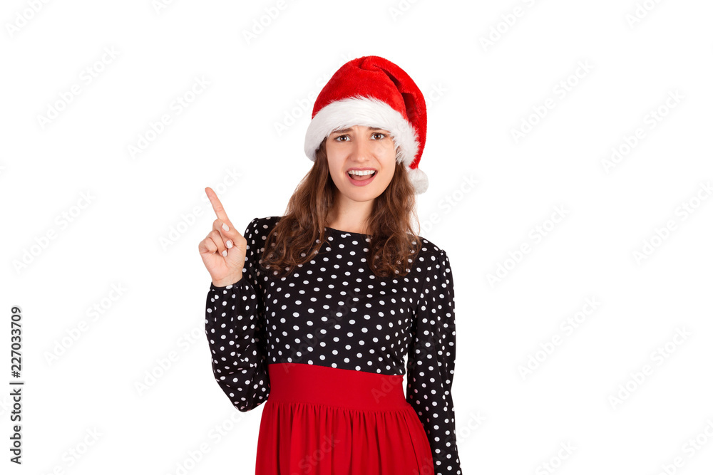 Portrait of feminine displeased gesturing with finger in no or refusal gesture. emotional girl in santa claus christmas hat isolated on white background. holiday concept Portrait of feminine displeased gesturing with finger in no or refusal gesture. emotional girl in santa claus christmas hat isolated on white background. holiday concept