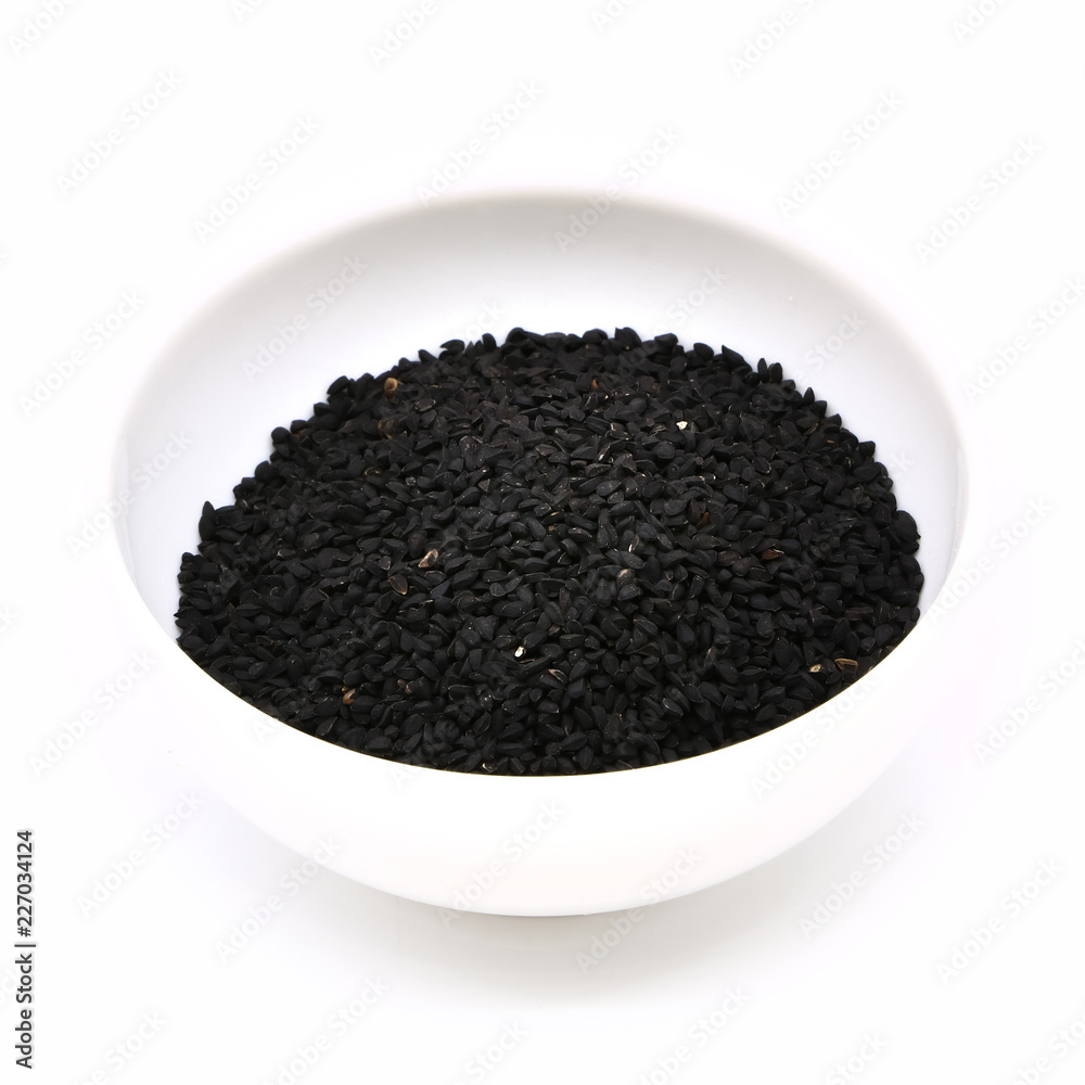 black cumin in a ceramic white cup, isolated black cumin in a ceramic white cup, isolated