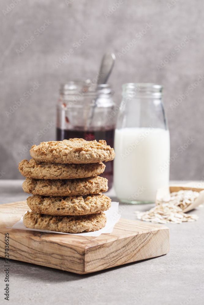 Oat cookies with milk bottle and jam jar. Oat cookies with milk bottle and jam jar.
