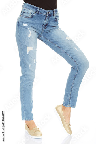 Woman's legs with blue denim on white background