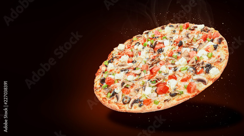 delicious fresh Italian pizza in the air just from the oven. there is space for text photo