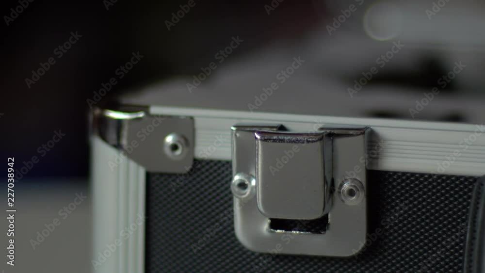 Man Open A Metal Suitcase Man Open A Metal Suitcase