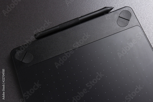Black graphic tablet. Designer tool for drawing. photo