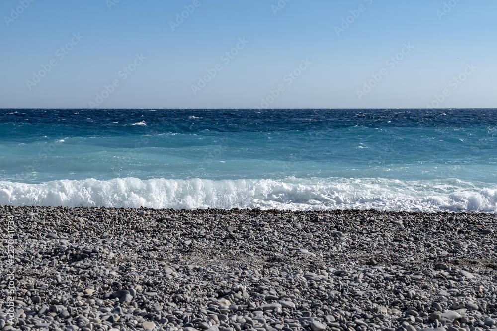 View from the beach in front of Nice on the surf in the Mediterranean on the French Riviera View from the beach in front of Nice on the surf in the Mediterranean on the French Riviera