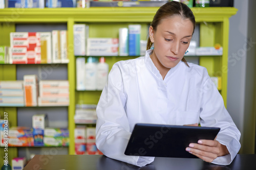 View of an attractive pharmacist at work