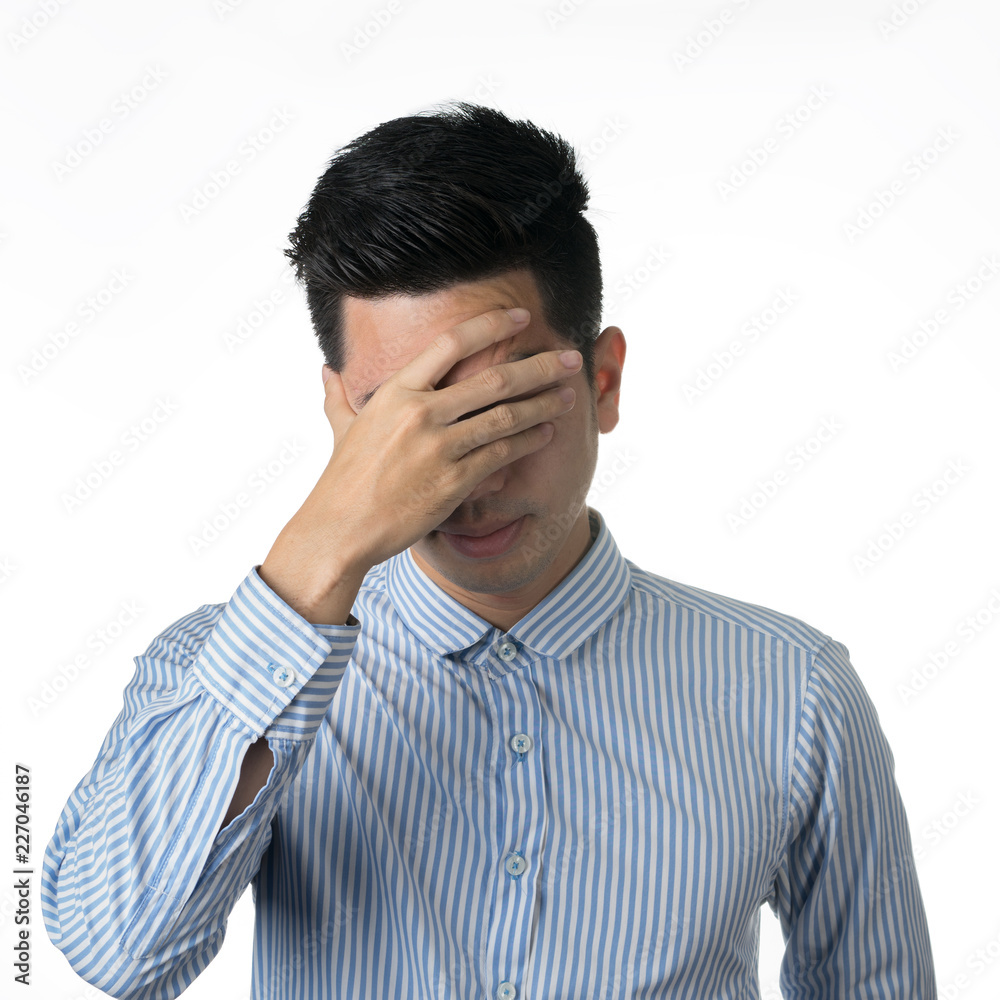 Portrait stressed and anxiety handsome young asian man wearing a blue shirt isolated on white wall background. Portrait stressed and anxiety handsome young asian man wearing a blue shirt isolated on white wall background.