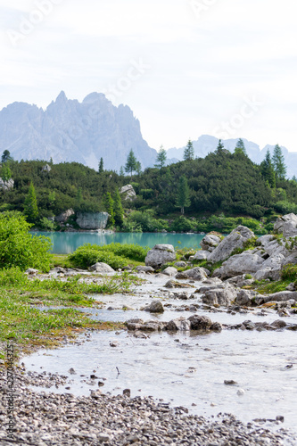 Detail shot of the wonderfull Sorapiss lake in the italian Alps, in the Dolomites mountains range close to Cortina in Veneto region, a unique place. The water of the lake is so blue it seems unreal photo