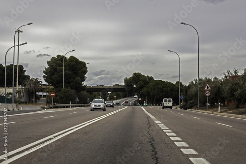 Cars on the road with traffic signs