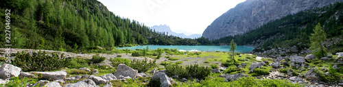 Panoramic shot of the wonderfull Sorapiss lake in the italian Alps, in the Dolomites mountains range close to Cortina in Veneto region, a unique place. The water of the lake is so blue it seems unreal