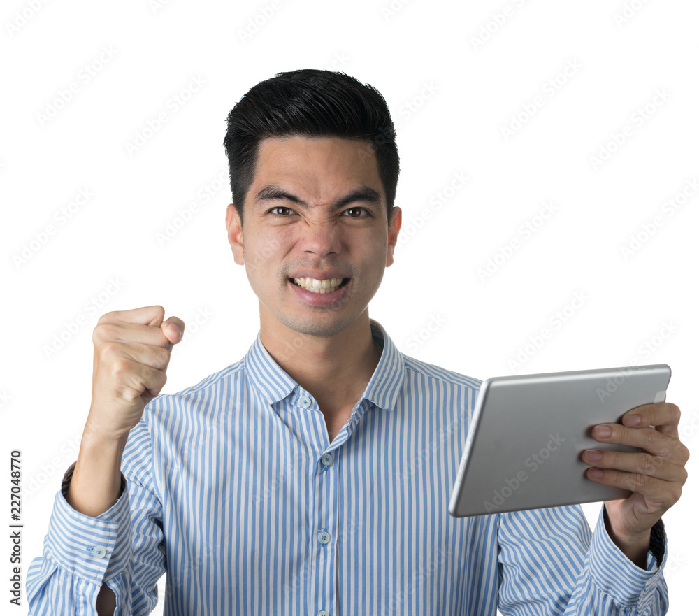 Portrait handsome young asian man wearing a blue shirt holding smart phone or tablet excitement or celebrating his victory sign isolated on white background. Asian man people. Portrait handsome young asian man wearing a blue shirt holding smart phone or tablet excitement or celebrating his victory sign isolated on white background. Asian man people.