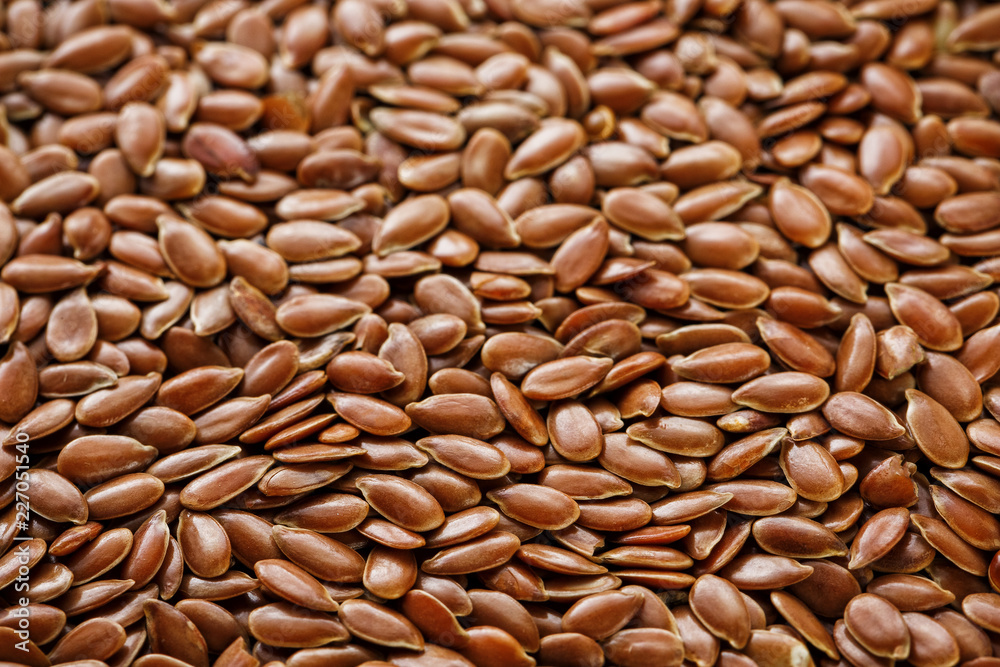 Background texture of seeds of dark brown flax. Background texture of seeds of dark brown flax.