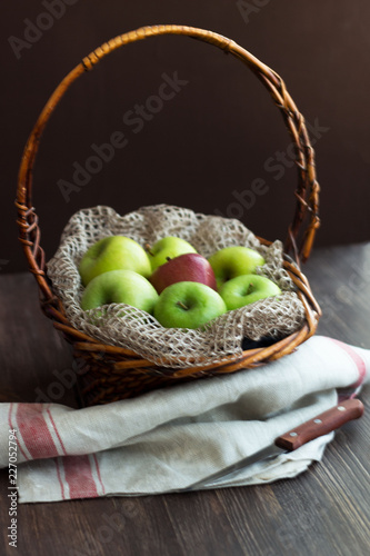natural green and red apples in basket