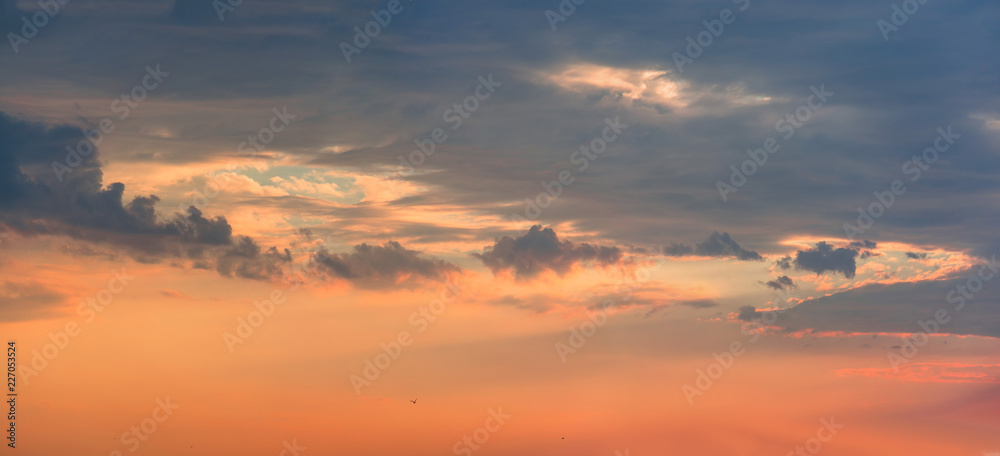 Colorful clouds on dramatic sunset sky