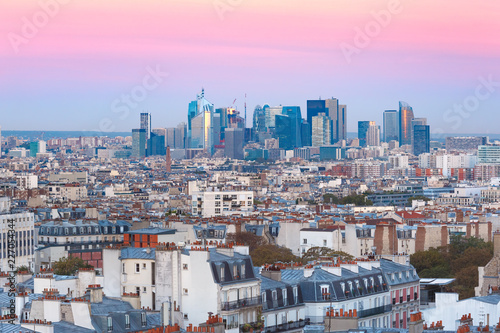 Aerial view from Montmartre over Paris roofs and La Defense business district at nice sunrise  Paris  France