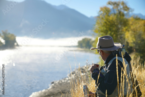 fly fisherman drinking a coffee