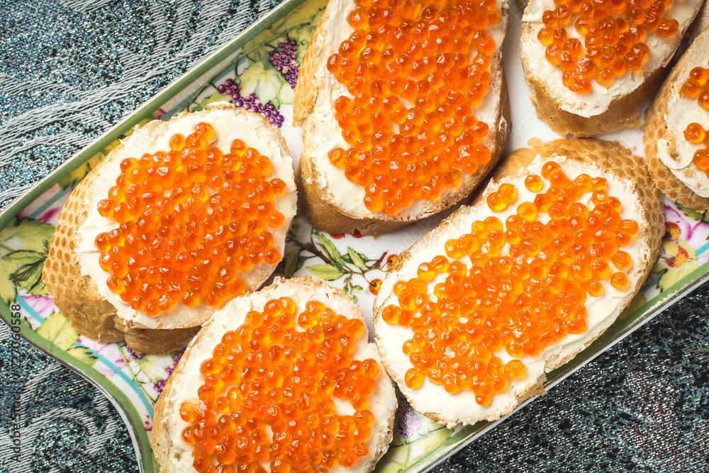 Sandwiches with red ROE and butter plate holiday table Sandwiches with red ROE and butter plate holiday table