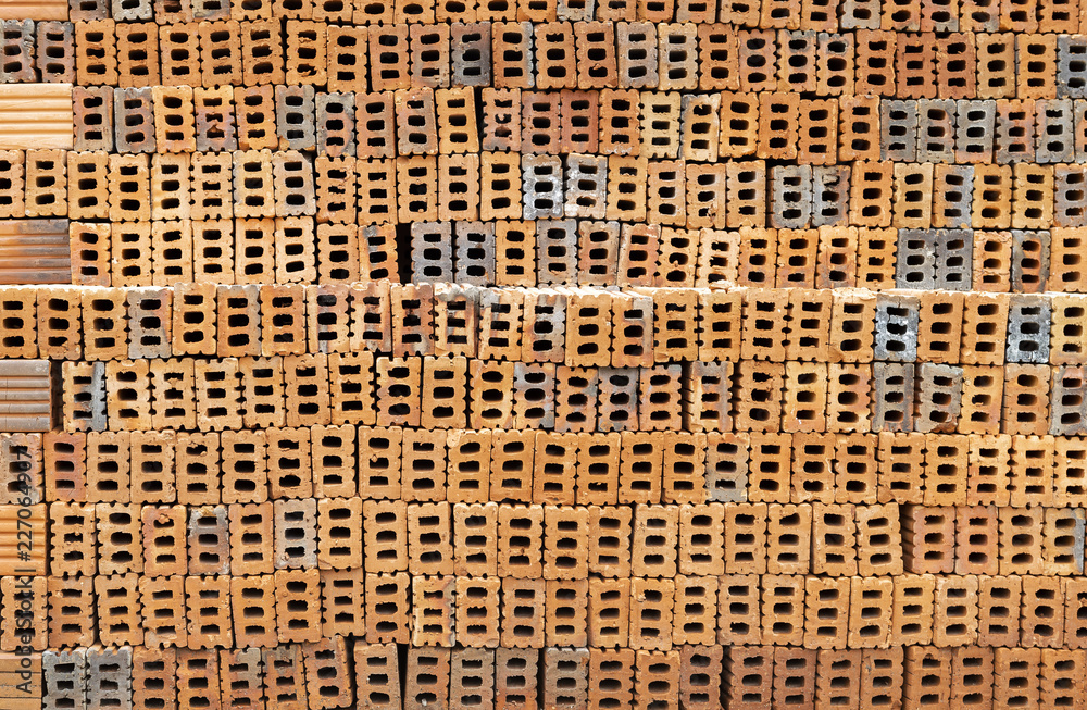 Red brick stack background, construction material Red brick stack background, construction material