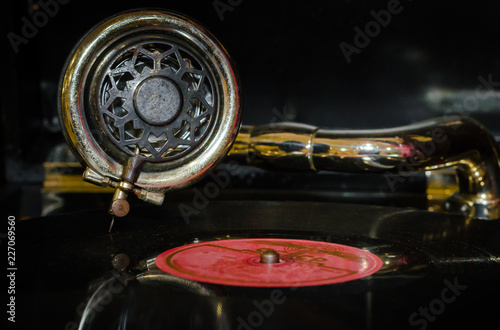 fragment of an old gramophone with a vinyl record