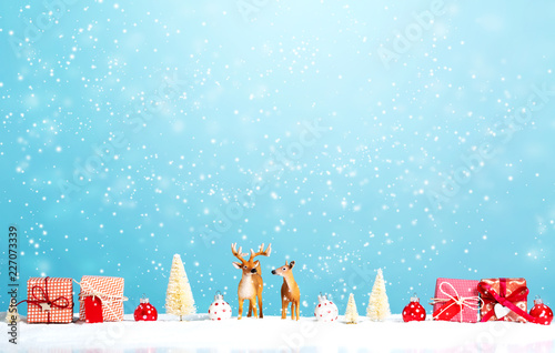 Wallpaper Mural Reindeer and Christmas gifts in snowy day Torontodigital.ca