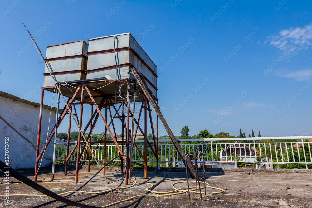 Rusty old metal tank for water heating, green energy Rusty old metal tank for water heating, green energy