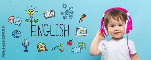 English with toddler boy with headphones on a blue background