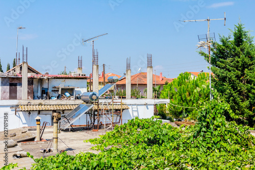 Solar panel, water heater on house roof, green energy